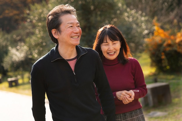 Medium shot retired couple walking together