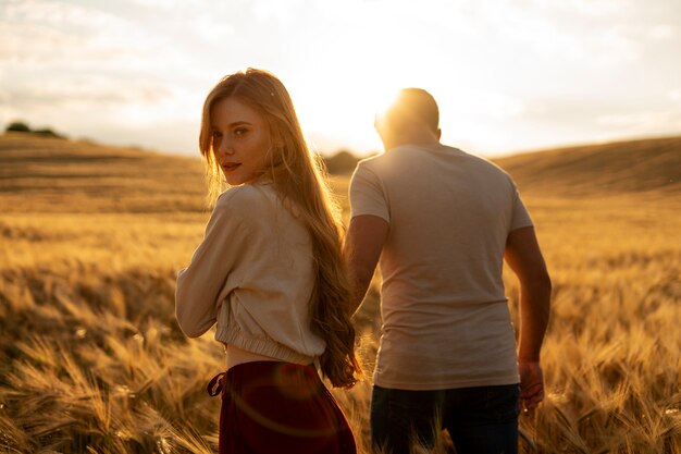 Medium shot romantic couple holding hands