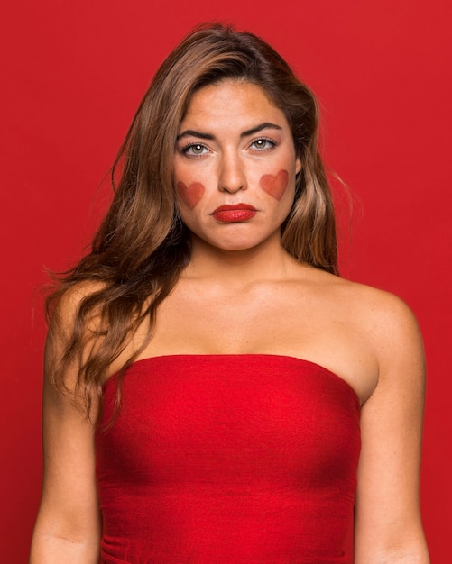 Free photo medium shot sad woman wearing red lipstick