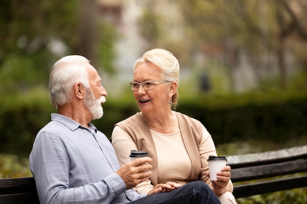 Medium shot senior couple on bench