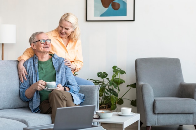 Medium shot senior couple indoors