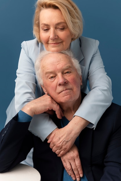 Medium shot senior couple posing together