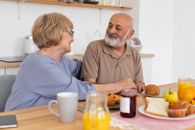 medium shot senior couple sitting together