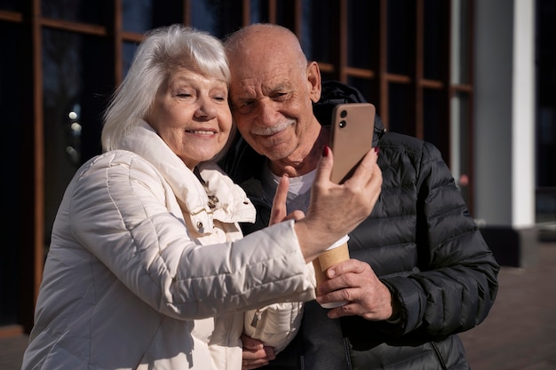 Medium Shot Senior Couple Taking Selfie