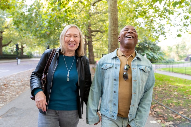 Medium shot senior couple walking together