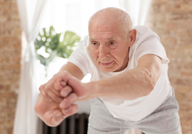 Medium shot senior man doing sport