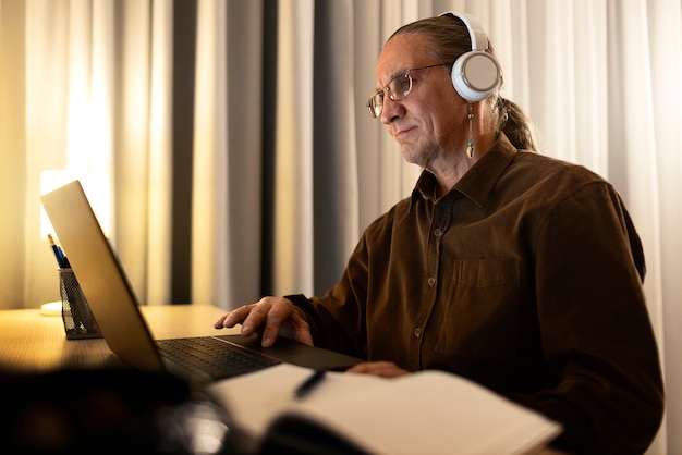 Medium shot senior man with headphones