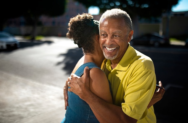 Medium shot senior people hugging