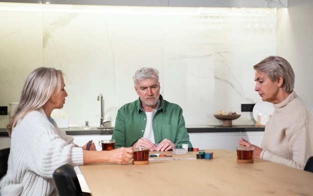 Medium shot senior people sitting at table