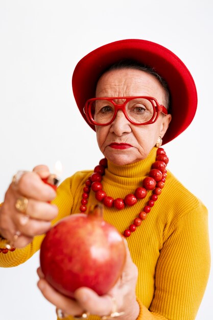 Medium shot senior woman posing in studio