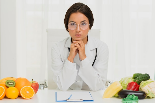 Medium shot serious nutritionist with glasses