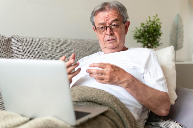 Free photo medium shot sick man on couch