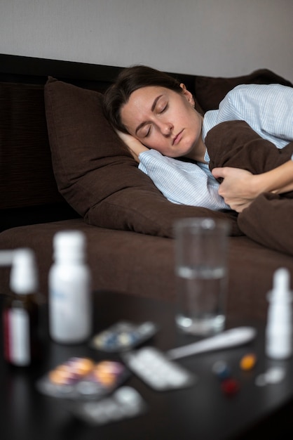 Medium shot sick woman sleeping