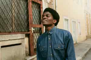 Free photo medium shot smiley black man in the 70s