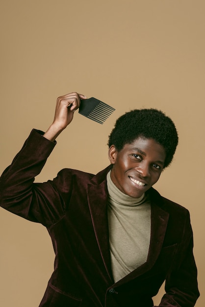 Medium shot smiley black man with comb