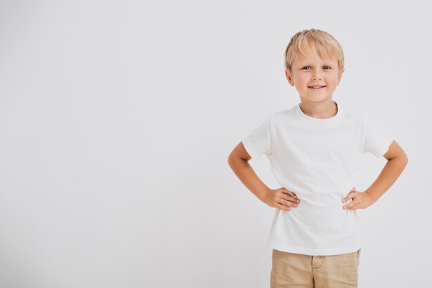 Medium shot smiley boy with copy space