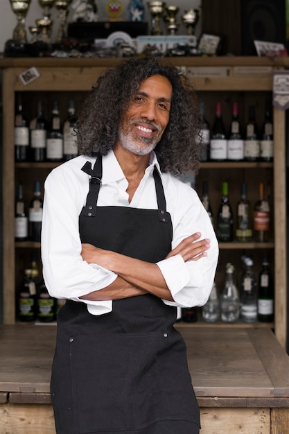 Medium shot smiley business owner with apron