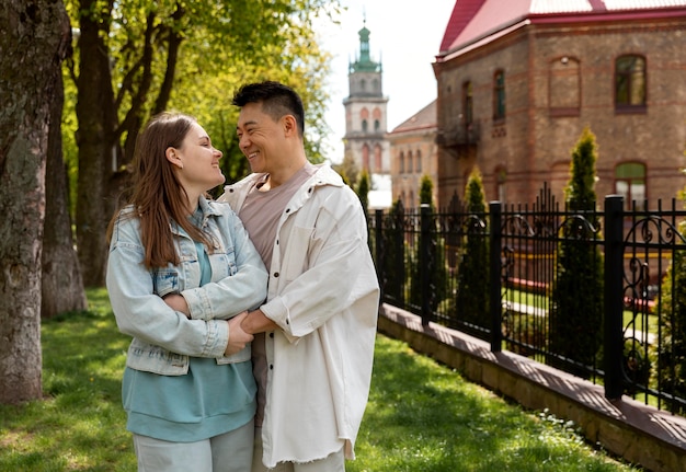 Medium shot smiley couple in nature