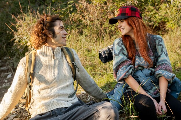 Medium shot smiley couple in nature