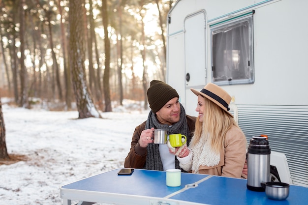 Medium shot smiley couple in nature