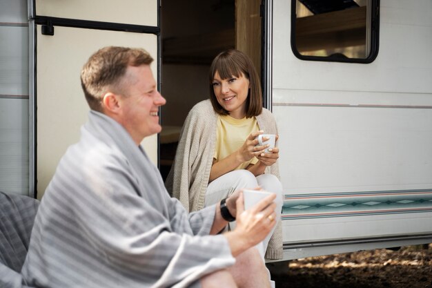 Medium shot smiley couple outdoors