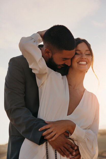 Medium shot smiley couple posing together