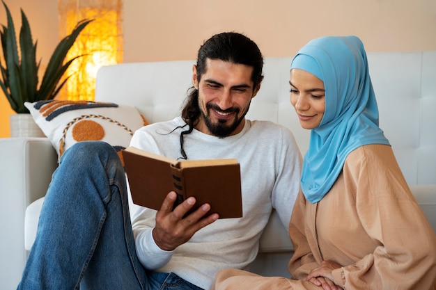 Medium shot smiley couple reading together