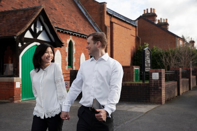 Medium shot smiley couple walking together