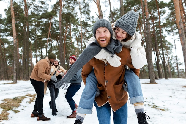 Free photo medium shot smiley couple winter season