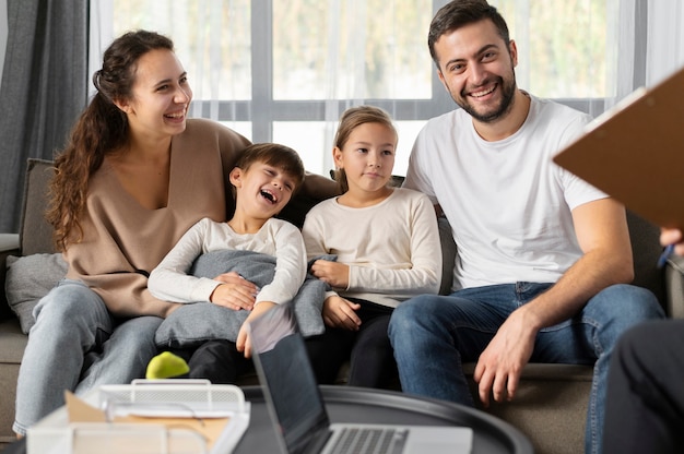 Medium shot smiley family at therapy