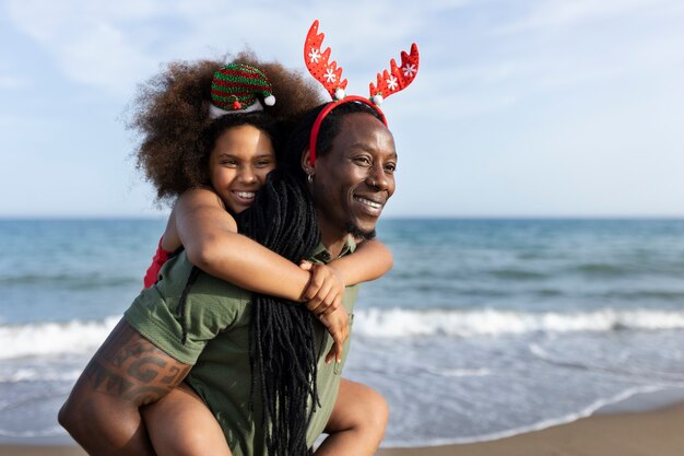 Medium shot smiley father carrying girl