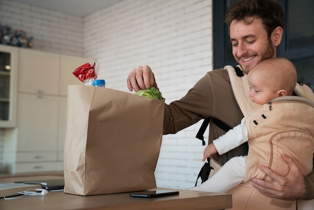 Medium shot smiley father with groceries