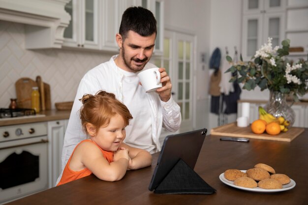 Medium shot smiley father with kid