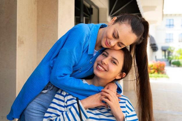 Medium shot smiley friends hugging