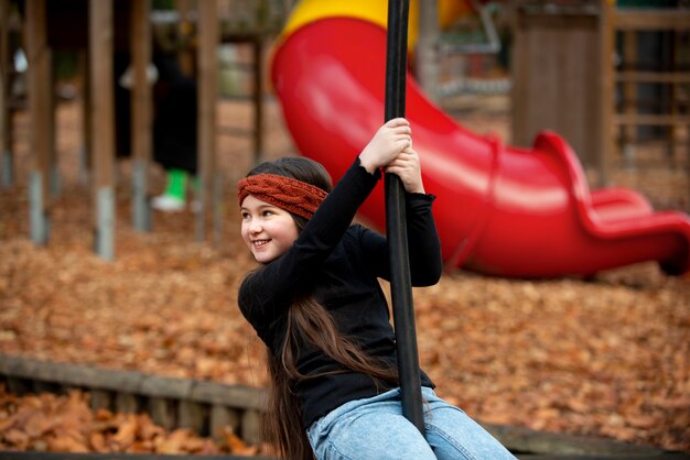 Medium shot smiley girl having fun