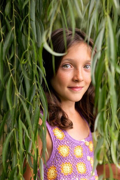 medium shot smiley girl in nature