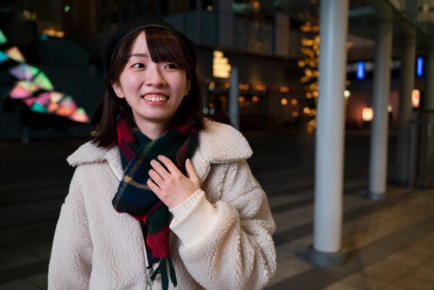 Medium shot smiley girl wearing scarf