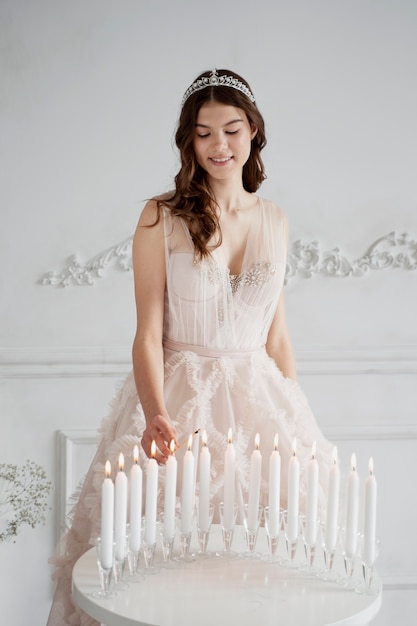 Free photo medium shot smiley girl with candles