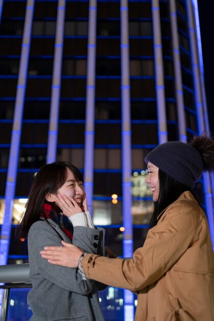 Medium shot smiley girls hanging out together