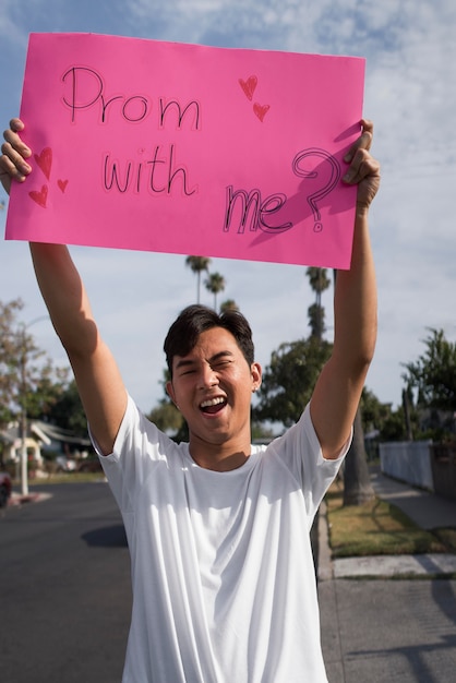 Free photo medium shot smiley guy invitation proposal