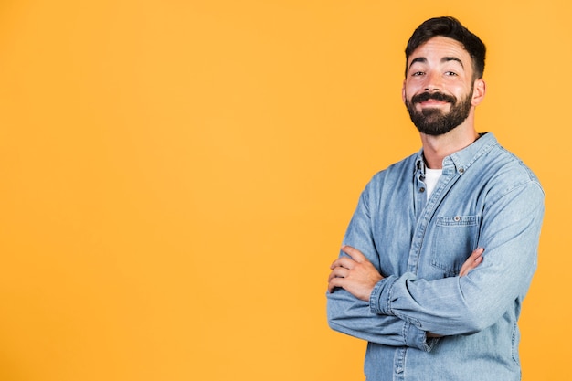 Medium shot smiley guy with arms crossed