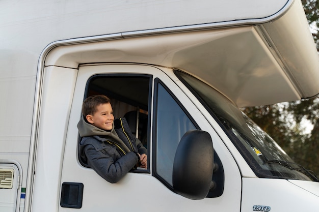 Medium shot smiley kid in camper