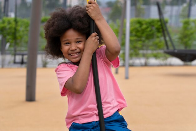 Medium shot smiley kid outdoors