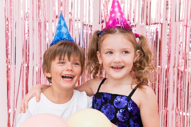 Free photo medium shot smiley kids posing together