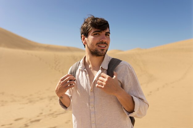 Medium shot smiley man carrying backpack