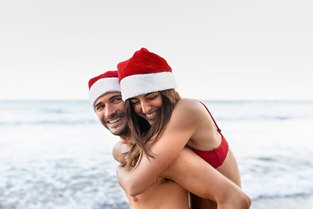 Medium shot smiley man carrying woman