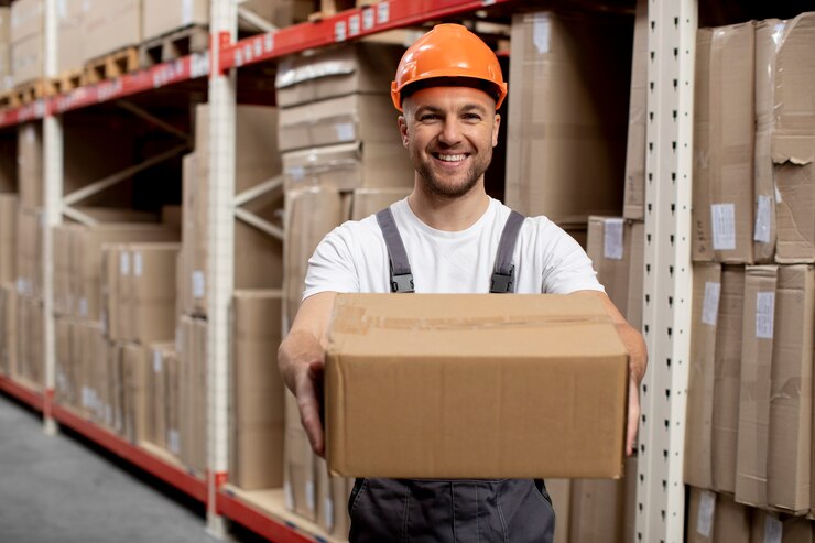 Free Photo medium shot smiley man holding box