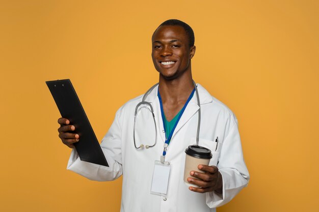 Medium shot smiley man holding coffee cup