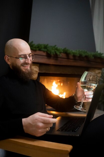 Medium shot smiley man holding laptop