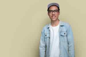 Free photo medium shot smiley man posing with hat